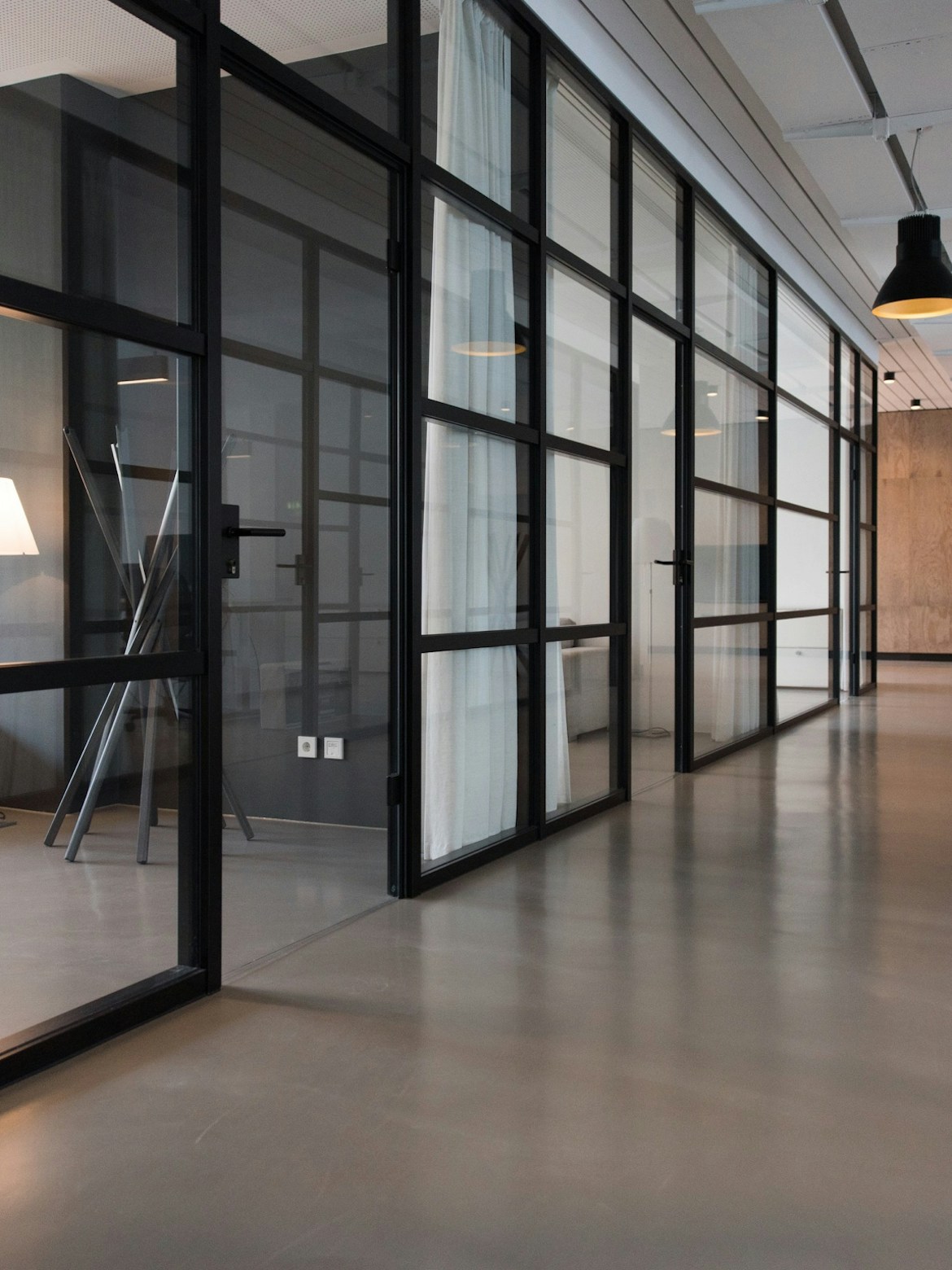 Class A office lobby renovation with stone clad columns and bronze elevator surrounds